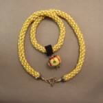 Fat Yellow Flower on woven necklace